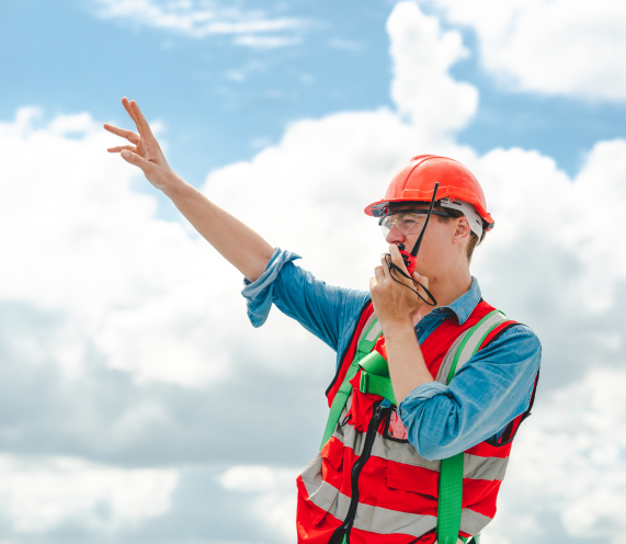 Man talking into walkie-talkie.